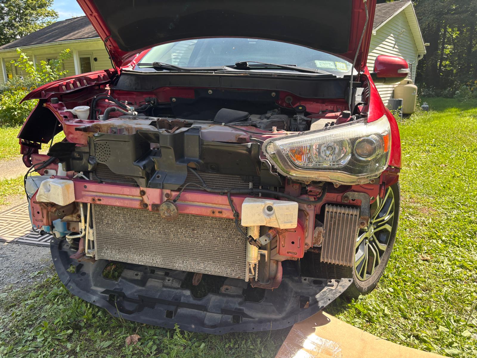 Mitsubishi Outlander with front bumper removed during exterior part replacement
